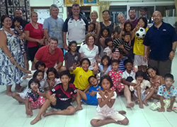 The Hands Across the Water team and recipients.