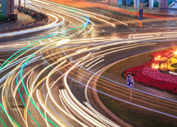 car light trails on the roundabout road at night